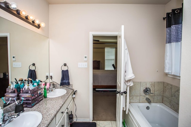 bathroom featuring vanity and a bath