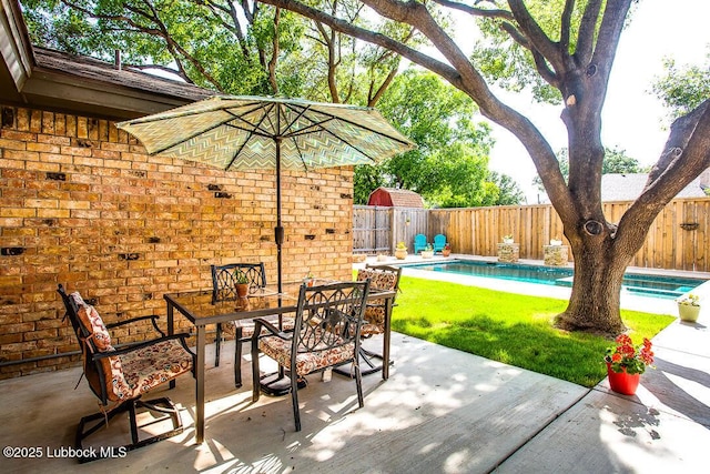 9206 Wayne Ave, Lubbock, TX 79424 - fenced backyard featuring outdoor dining space and a patio