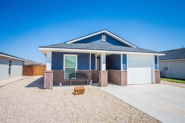 view of front of property with a porch and a garage