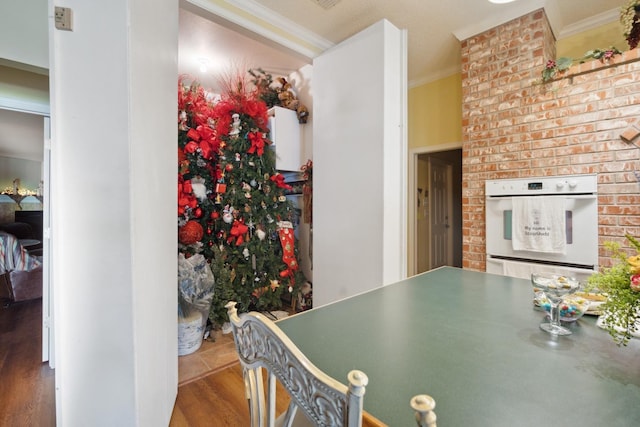 interior space featuring ornamental molding and hardwood / wood-style floors