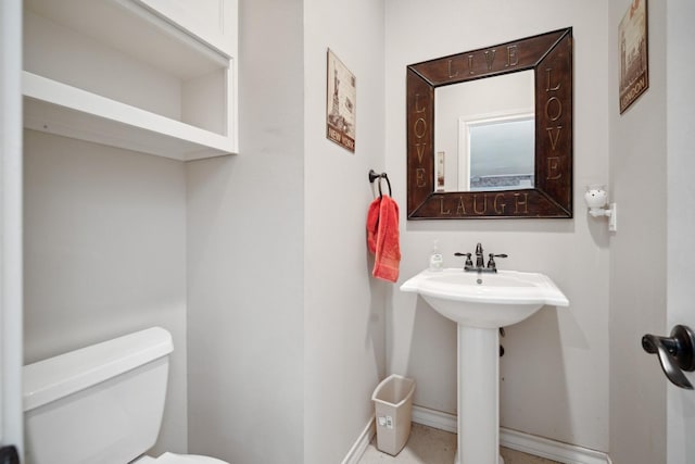 bathroom with sink and toilet