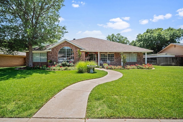 ranch-style house with a front lawn