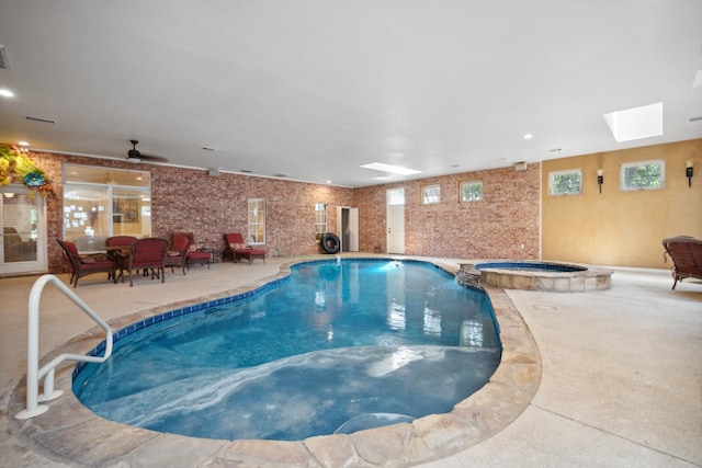 view of pool with a skylight