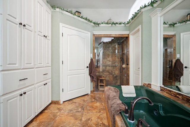 bathroom featuring independent shower and bath