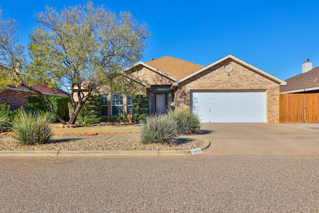 single story home featuring a garage