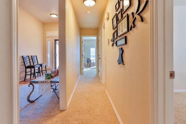 corridor with light carpet