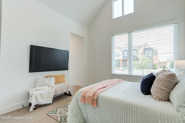 4029 136th St, Lubbock, TX 79423 - bedroom featuring multiple windows, wood finished floors, baseboards, and high vaulted ceiling