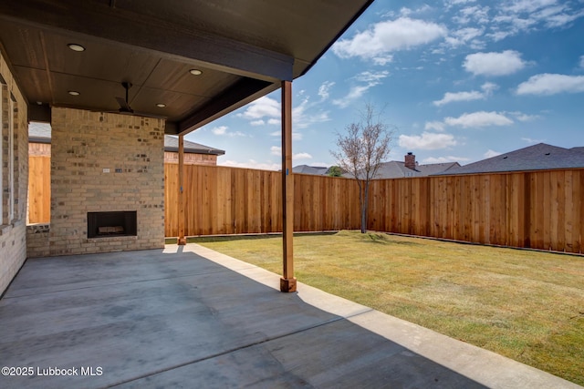 4029 136th St, Lubbock, TX 79423 - view of patio / terrace featuring an outdoor brick fireplace