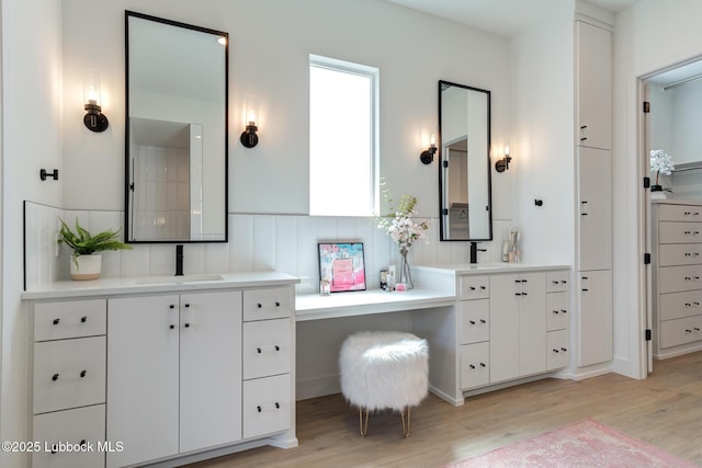 4029 136th St, Lubbock, TX 79423 - bathroom with wood finished floors and two vanities