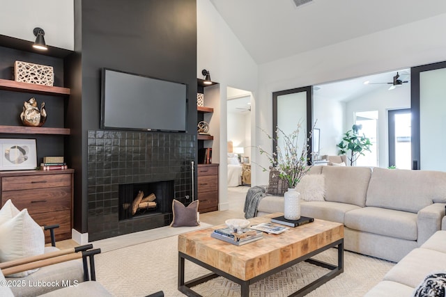 4029 136th St, Lubbock, TX 79423 - living room with ceiling fan, a fireplace, and high vaulted ceiling