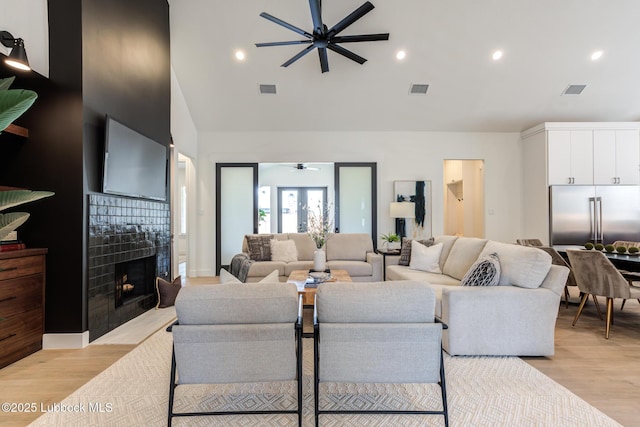 4029 136th St, Lubbock, TX 79423 - living area featuring ceiling fan, light wood-style floors, a fireplace, recessed lighting, and high vaulted ceiling