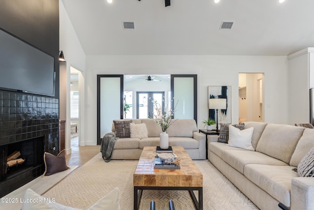 4029 136th St, Lubbock, TX 79423 - living room featuring a ceiling fan, a fireplace with flush hearth, light wood-style floors, recessed lighting, and baseboards