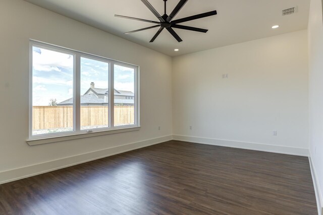 7710 46th St, Lubbock, TX 79407 - spare room featuring dark wood finished floors, recessed lighting, and a ceiling fan