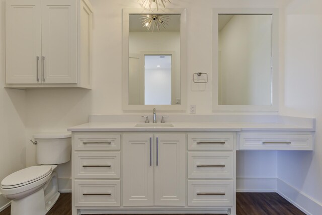 7710 46th St, Lubbock, TX 79407 - bathroom featuring vanity and wood finished floors
