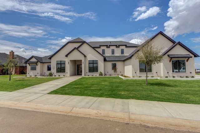 7710 46th St, Lubbock, TX 79407 - french provincial home with stucco siding and a front lawn