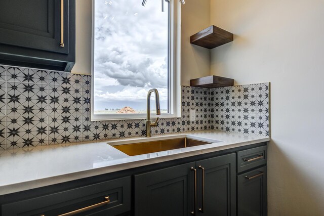 7710 46th St, Lubbock, TX 79407 - kitchen with backsplash, open shelves, light countertops, and dark cabinetry