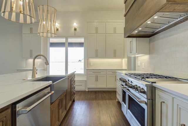 7710 46th St, Lubbock, TX 79407 - kitchen with stainless steel appliances, custom range hood, backsplash, and white cabinetry
