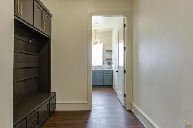 7710 46th St, Lubbock, TX 79407 - mudroom featuring dark wood-type flooring and a chandelier
