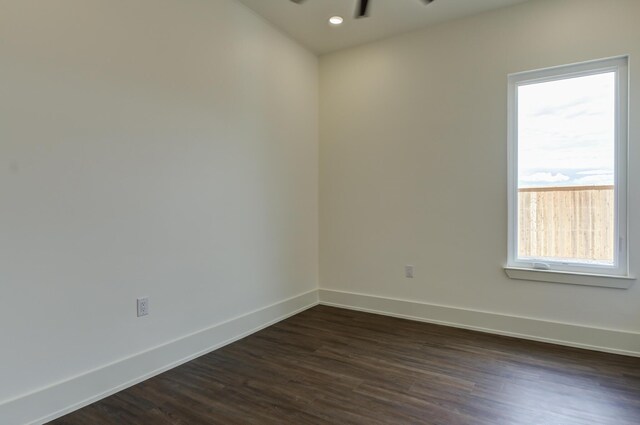7710 46th St, Lubbock, TX 79407 - unfurnished room with dark wood finished floors, a ceiling fan, and recessed lighting