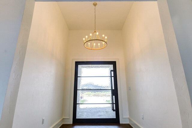 7710 46th St, Lubbock, TX 79407 - foyer with a chandelier and baseboards