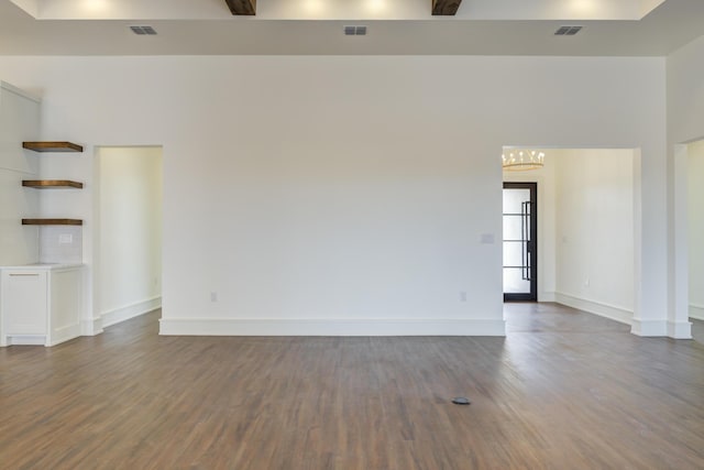 7710 46th St, Lubbock, TX 79407 - unfurnished room featuring dark wood finished floors and a chandelier