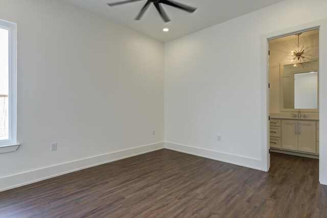 7710 46th St, Lubbock, TX 79407 - unfurnished room with dark wood-style flooring, ceiling fan, a chandelier, and recessed lighting