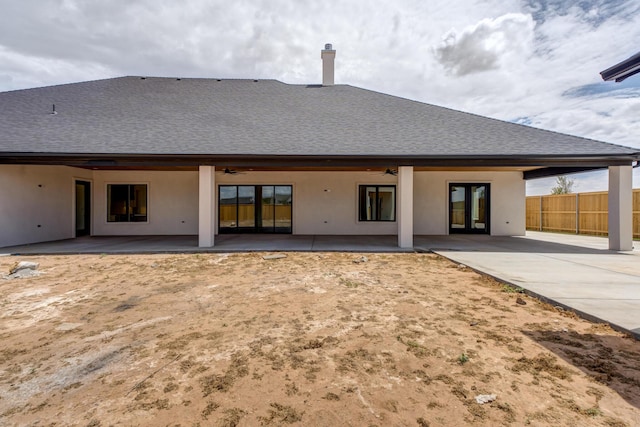 7710 46th St, Lubbock, TX 79407 - back of house with ceiling fan, a shingled roof, stucco siding, and a patio area