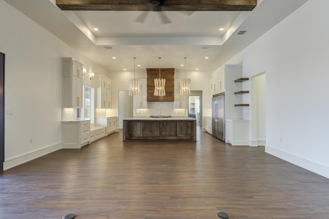 7710 46th St, Lubbock, TX 79407 - kitchen with high quality fridge, a raised ceiling, dark wood-type flooring, a ceiling fan, and recessed lighting