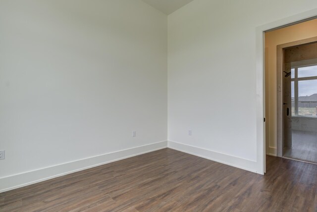 7710 46th St, Lubbock, TX 79407 - unfurnished room with dark wood finished floors and baseboards