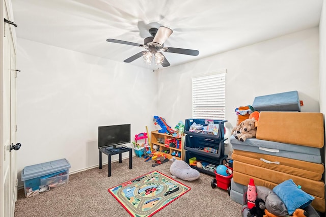 game room with carpet floors and ceiling fan