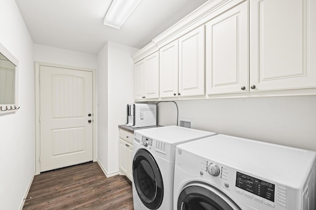 laundry room with cabinet space, separate washer and dryer, dark wood-style floors, and baseboards