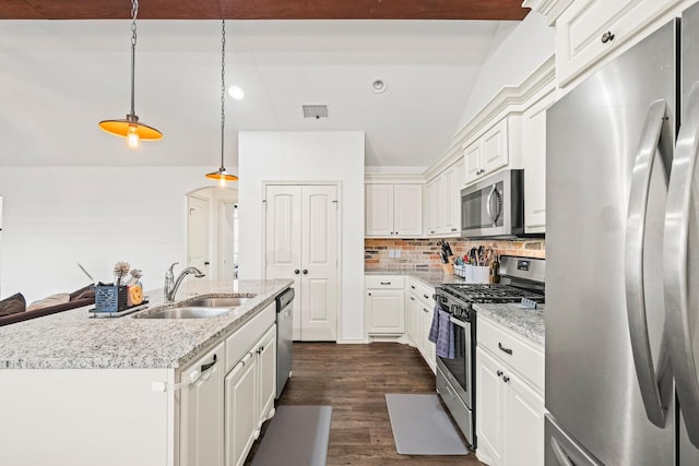 kitchen featuring appliances with stainless steel finishes, a sink, white cabinetry, and dark wood-style floors
