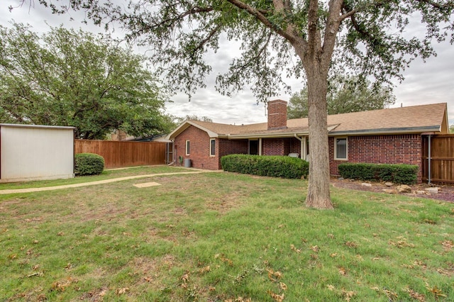 5530 92nd St, Lubbock, TX 79424 - rear view of house featuring brick siding and a chimney