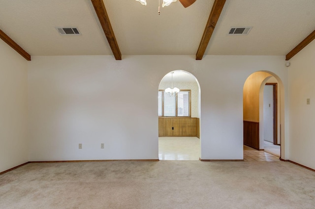 5530 92nd St, Lubbock, TX 79424 - unfurnished room featuring beam ceiling, light carpet, arched walkways, and a ceiling fan