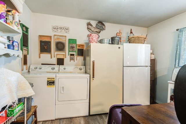 washroom featuring hardwood / wood-style flooring and washer and dryer