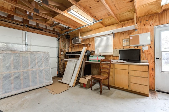 interior space featuring a wall mounted AC and wooden walls