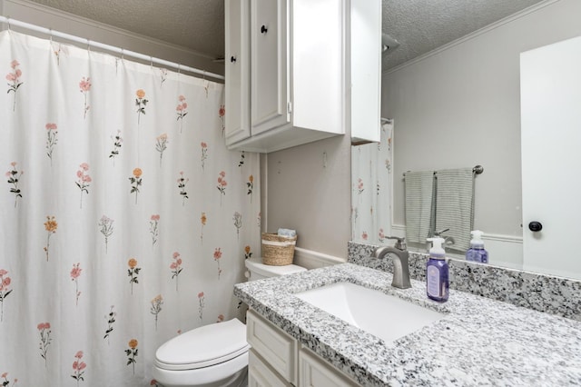 bathroom featuring crown molding, vanity, toilet, and a textured ceiling