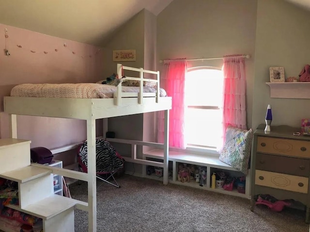 bedroom featuring lofted ceiling and carpet