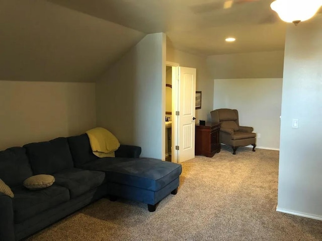 living room featuring light colored carpet and lofted ceiling