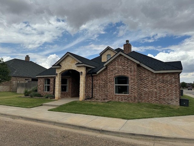 view of front of home with a front lawn