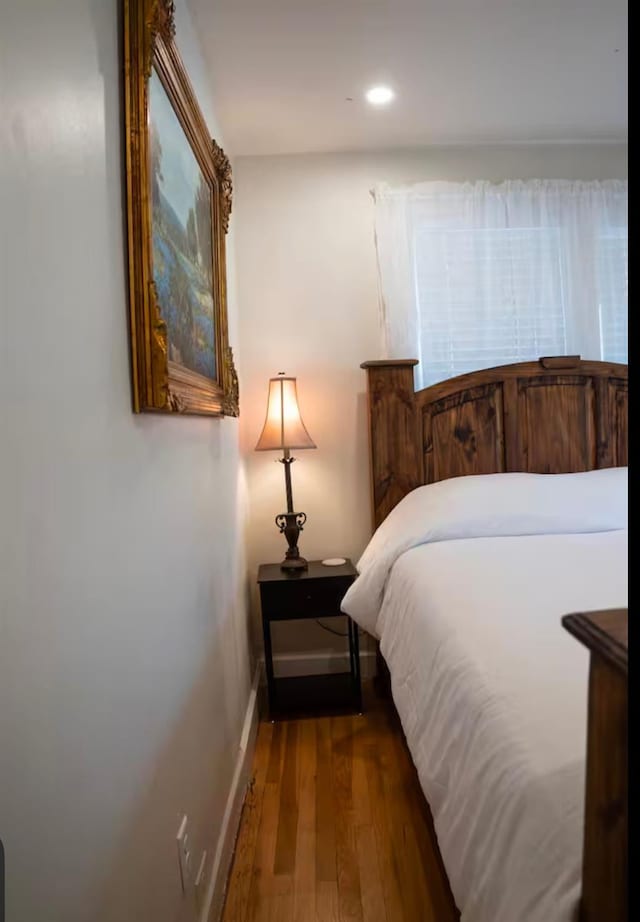 bedroom with wood-type flooring