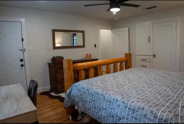 bedroom featuring hardwood / wood-style flooring and ceiling fan