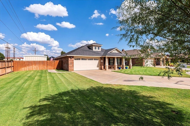 view of front facade featuring a garage and a front lawn