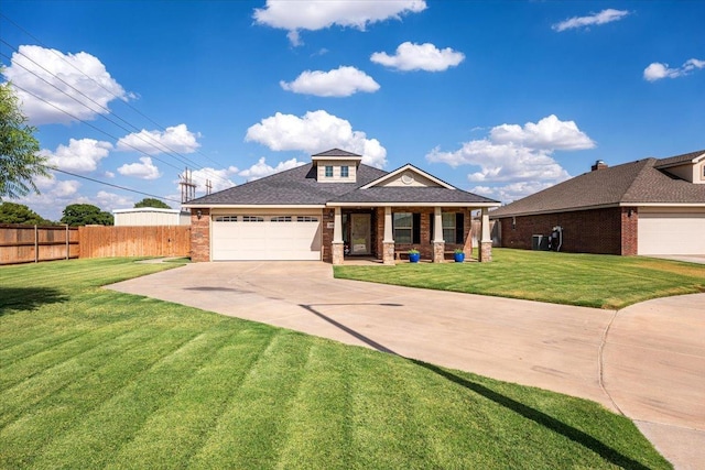 view of front facade featuring a garage and a front yard