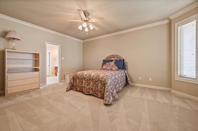 carpeted bedroom featuring a textured ceiling, ornamental molding, ceiling fan, and ensuite bathroom