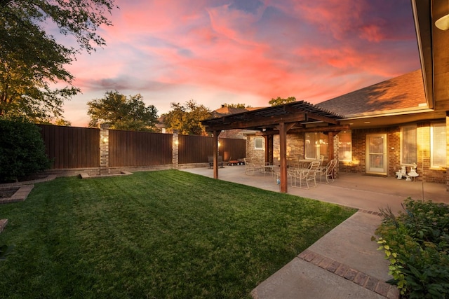 yard at dusk featuring a pergola and a patio