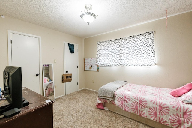 carpeted bedroom with a textured ceiling