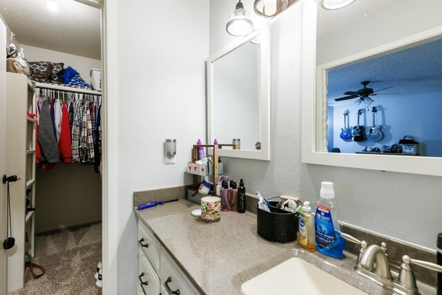 bathroom with vanity and ceiling fan