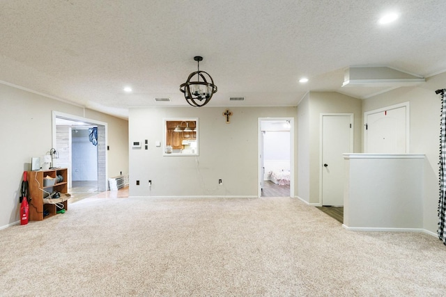 interior space featuring an inviting chandelier and a textured ceiling