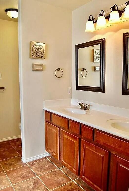 bathroom with vanity and tile patterned floors